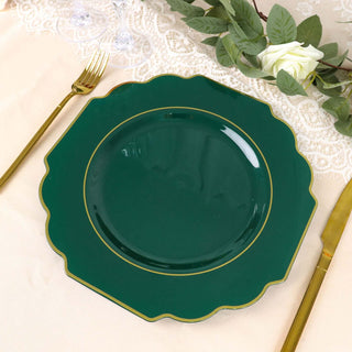 Green scalloped plate with gold trim on a textured table setting.