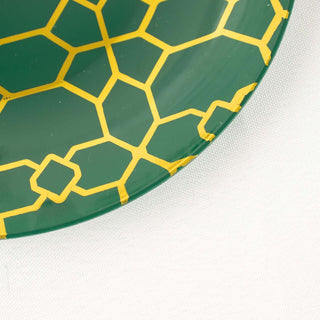 Green plate with yellow honeycomb pattern, partially damaged.