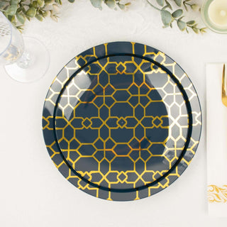 Navy blue plate with gold geometric pattern on a table setting.