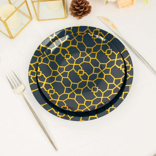Decorative navy plate with gold geometric pattern on a table setting.