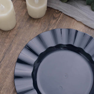 Elegant dark gray plate with a scalloped edge on a wooden surface.