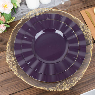 Stacked elegant purple plates with a gold rim on a wooden table.