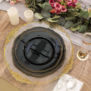 Elegant black and gold dinner plate set on a wooden table with floral arrangement.
