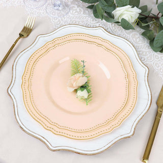 Elegant pink decorative plate with floral accent on a lace table setting.