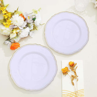 Elegant lavender plates with gold trim, styled with floral arrangement.