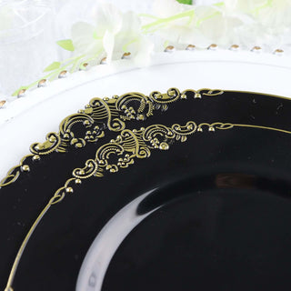 Elegant black plate with gold ornate design details.
