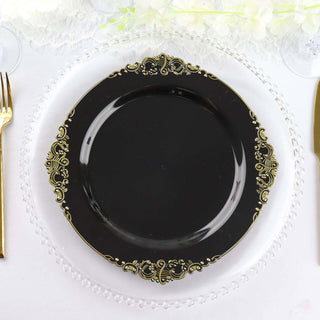 Elegant black plate with gold detailing on a clear charger.