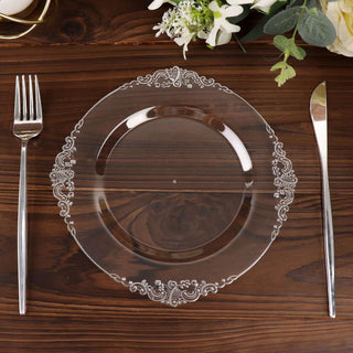 Elegant clear glass plate with intricate lace design on wooden table.