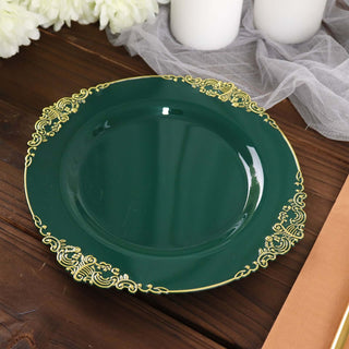 Elegant green plate with gold trim on wooden surface.