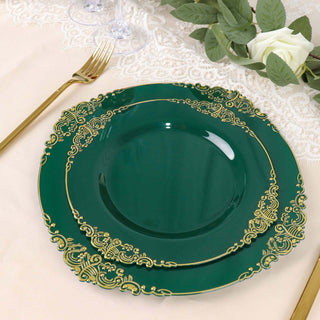 Elegant green dinner plates with gold trim on a table setting.
