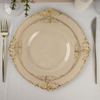 Elegant beige plate with ornate gold detailing on a table setting.