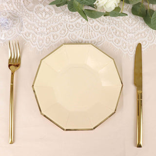 Elegant octagonal cream plate with gold trim, styled with gold cutlery.