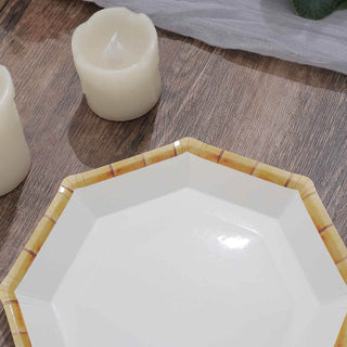Octagonal white plate with bamboo-style trim on a wooden surface.