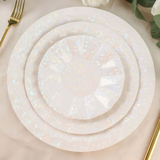 Holographic disposable plates set in three sizes on a neutral table setting.