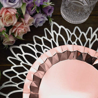 Rose gold decorative plate with intricate silver lace design and floral arrangement.