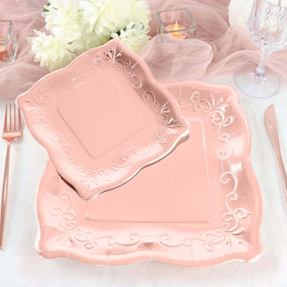 Pink decorative plates set on a table with elegant floral accents.