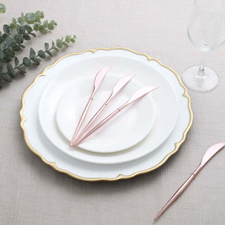 Elegant pink knives on a white plate set with gold accents.