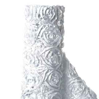 White rose-patterned fabric roll against a plain background
