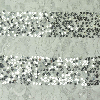 Silver sequin fabric with floral lace pattern.
