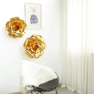 Gold decorative flowers on a white wall with a framed art piece above.