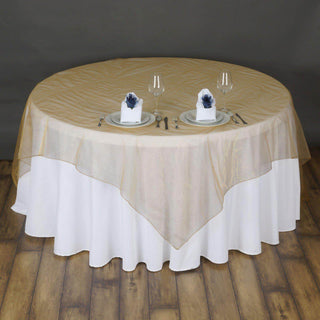 Add Elegance to Your Event with the Gold Organza Table Overlay Add Elegance to Your Event with the Gold Organza Table Overlay