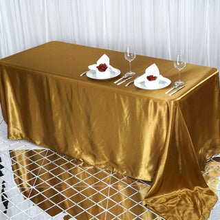 Elevate Your Event with the Stunning Gold Satin Seamless Rectangular Tablecloth