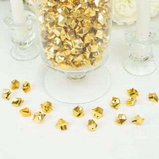 Gold decorative confetti pieces scattered around a glass jar filled with more confetti.