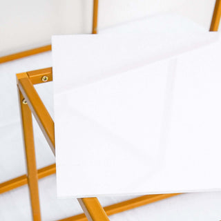White tabletop with gold metal frame in studio isolation shot.
