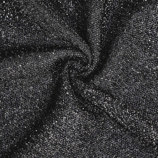 Black shimmering fabric texture close-up, showcasing intricate details.