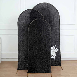 Three black decorative privacy screens in varying heights against a plain background.