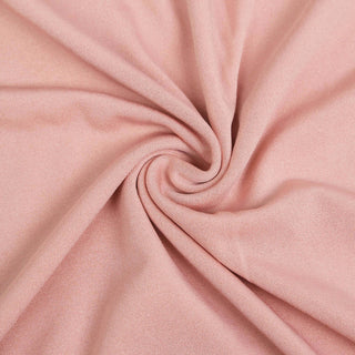 Pink fabric close-up showing smooth texture and drape.