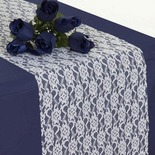 Navy table runner with lace overlay and blue rose accents