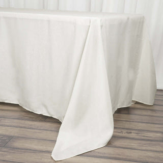 Elevate Your Event with the Ivory Polyester Rectangle Tablecloth Elevate Your Event with the Ivory Polyester Rectangle Tablecloth