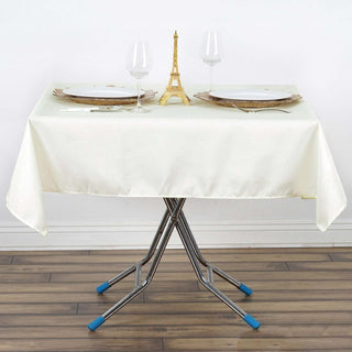 Elevate Your Event with the Ivory Premium Polyester Square Tablecloth Elevate Your Event with the Ivory Premium Polyester Square Tablecloth
