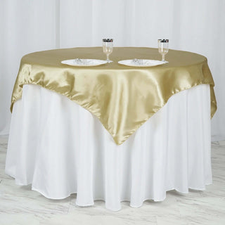 Add a Touch of Elegance with the 60"x60" Champagne Square Smooth Satin Table Overlay Add a Touch of Elegance with the 60"x60" Champagne Square Smooth Satin Table Overlay