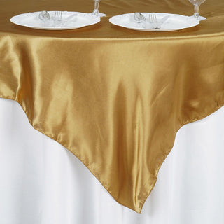 Create a Festive Atmosphere with the Gold Square Smooth Satin Table Overlay