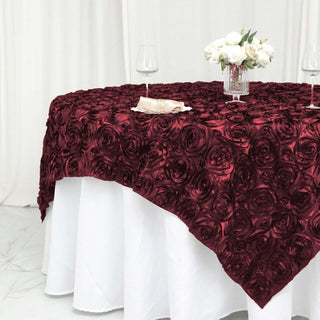 Upgrade Your Tablescape with the Burgundy 3D Rosette Satin Square Table Overlay Upgrade Your Tablescape with the Burgundy 3D Rosette Satin Square Table Overlay