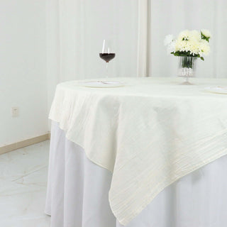 Create a Memorable Event with our Ivory Accordion Crinkle Taffeta Table Overlay Create a Memorable Event with our Ivory Accordion Crinkle Taffeta Table Overlay