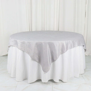 Add Elegance to Your Event with the Silver Accordion Crinkle Taffeta Table Overlay Add Elegance to Your Event with the Silver Accordion Crinkle Taffeta Table Overlay