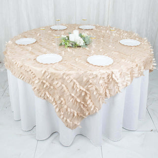 Round table adorned with a textured beige tablecloth and white plates.