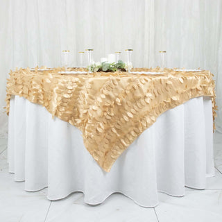 Gold leaf tablecloth draped elegantly over a white table.