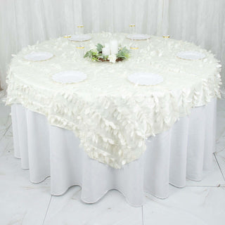 Round white tablecloth with floral texture displayed on a table.