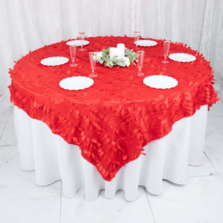 Round red tablecloth with decorative petals, styled for an elegant dining setting.