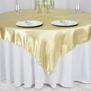 Create a Luxurious Ambiance with the Champagne Seamless Satin Square Tablecloth Overlay