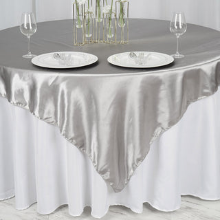 Elevate Your Event with the Silver Seamless Satin Square Tablecloth Overlay