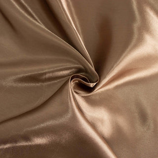 Shiny brown fabric with smooth texture in a swirl pattern.