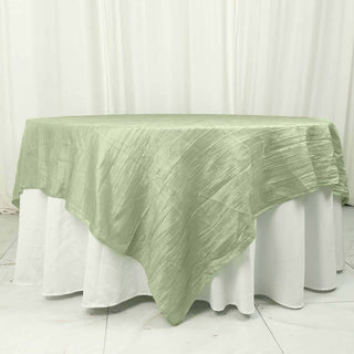 Elevate Your Event Decor with the 90"x90" Sage Green Accordion Crinkle Taffeta Square Table Overlay Elevate Your Event Decor with the 90"x90" Sage Green Accordion Crinkle Taffeta Square Table Overlay