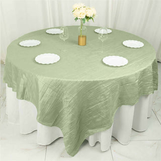 Create a Timeless and Enchanting Atmosphere with the Sage Green Accordion Crinkle Taffeta Square Table Overlay Create a Timeless and Enchanting Atmosphere with the Sage Green Accordion Crinkle Taffeta Square Table Overlay