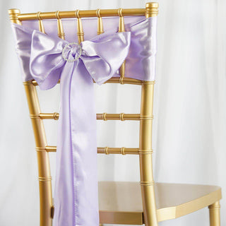 Gold chiavari chair with lavender satin bow on the back.