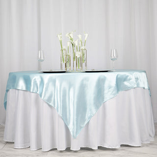Create Unforgettable Memories with our Light Blue Satin Tablecloth Overlay
